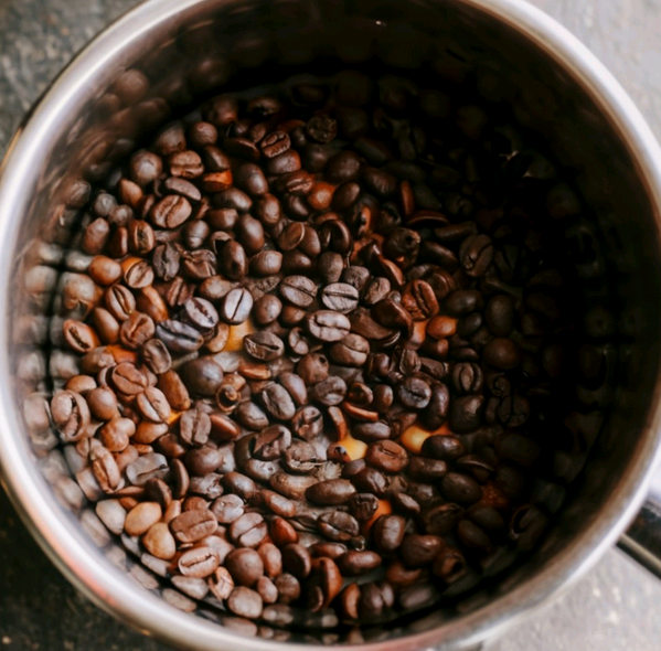 Roast coffee beans in a specialty roasting pan